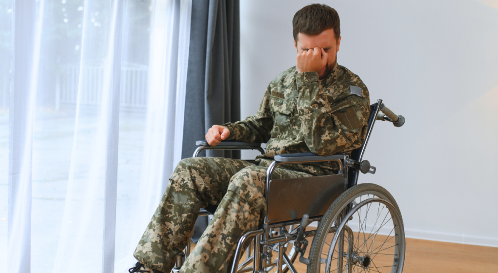 A frustrated veteran sits in a wheelchair, reflecting the challenges of severe service-connected disabilities like Fournier’s gangrene. The image highlights the need for Total Disability Individual Unemployability (TDIU) to support those unable to work due to their condition.