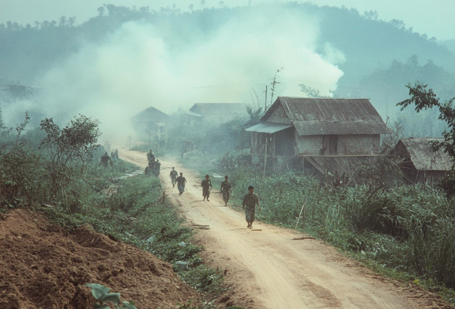 Archival image of Agent Orange spraying in Vietnam, linking exposure to health issues like diabetes and diabetic retinopathy.