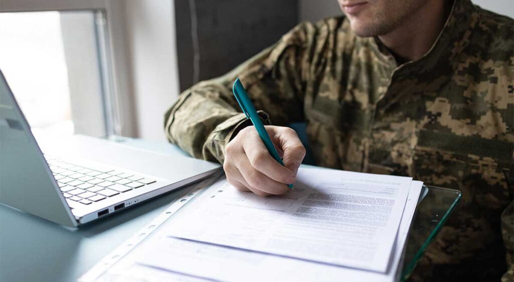A veteran carefully organizes paperwork—an important step for those already rated for sleep apnea. With upcoming changes to VA sleep apnea criteria, it's crucial for veterans to review their ratings and ensure they’re receiving the correct benefits.
